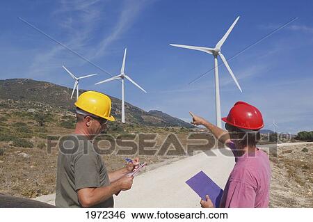 technicians inspecting windmills at a windfarm near tarifa; cadiz andalusia spain View Large Photo Image Stock Photograph - technicians inspecting windmills at a windfarm near tarifa; cadiz andalusia spain. Fotosearch