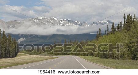 the canadian rocky mountains viewed from the highway; jasper, alberta, canada View Large Photo Image Stock Photograph - the canadian rocky mountains viewed from the highway; jasper, alberta, canada. Fotosearch