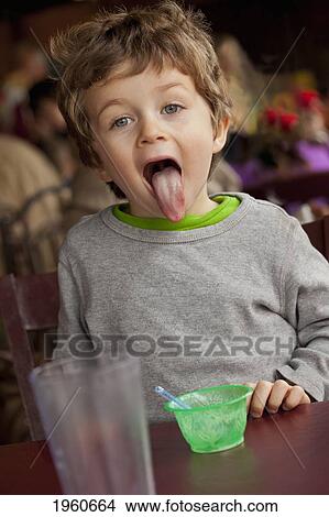 toddler finished his ice cream in a restaurant; st. albert, alberta, canada View Large Photo Image Picture - toddler finished his ice cream in a restaurant; st. albert, alberta, canada. Fotosearch