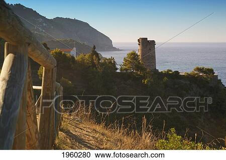 Stock Image - torre del pino watchtower on the cliffs of maro-cerro gordo natural park, near maro and nerja; malaga province, costa del sol, andalusia, spain. Fotosearch