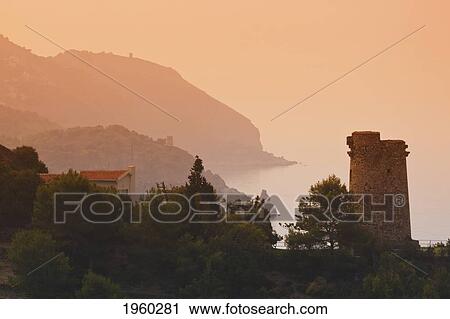 Stock Image - torre del pino watchtower on the cliffs of maro-cerro gordo natural park, near maro and nerja; malaga province, costa del sol, andalusia, spain. Fotosearch