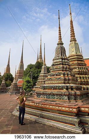 tourist viewing chedi at buddhist temple; bangkok, thailand View Large Photo Image Stock Photograph - tourist viewing chedi at buddhist temple; bangkok, thailand. Fotosearch