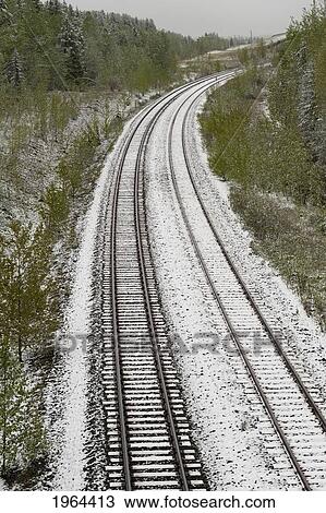 train tracks lightly covered with snow; alberta, canada View Large Photo Image Stock Image - train tracks lightly covered with snow; alberta, canada. Fotosearch