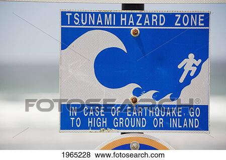 Stock Photo - tsunami warning sign with the ocean in the background; lincoln city oregon united states of america. Fotosearch