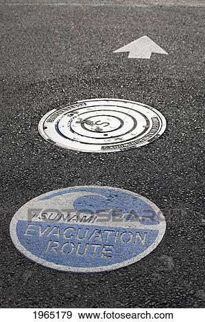 Stock Photo - tsunami warning signs on the road with arrow for direction; lincoln city oregon united states of america. Fotosearch