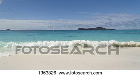 water washing up on the white sand in gardner bay with a view of an island; galapagos, equador View Large Photo Image Stock Photograph - water washing up on the white sand in gardner bay with a view of an island; galapagos, equador. Fotosearch