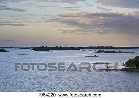 waterways through the islands at sunset; stockholm, sweden View Large Photo Image Stock Image - waterways through the islands at sunset; stockholm, sweden. Fotosearch