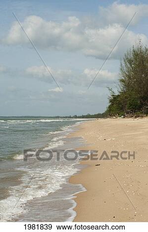 waves rolling into a beach; prachuap kiri khan prachuap province thailand View Large Photo Image Stock Photo - waves rolling into a beach; prachuap kiri khan prachuap province thailand. Fotosearch