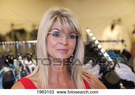 woman shopping for clothing in a boutique; edmonton, alberta, canada View Large Photo Image Stock Image - woman shopping for clothing in a boutique; edmonton, alberta, canada. Fotosearch