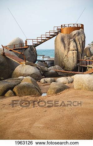 wooden steps and ramp over boulders on the beach; koh tao, thailand View Large Photo Image Stock Photograph - wooden steps and ramp over boulders on the beach; koh tao, thailand. Fotosearch