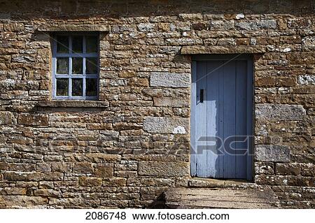A blue painted door and window trim on a stone building; swaledale england View Large Photo Image Stock Photo - A blue painted door and window trim on a stone building; swaledale england. Fotosearch