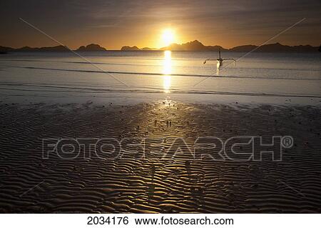 A Boat Is Silhouetted At Sunset At The Beach; Corong Corong Bacuit Archipelago Palawan Philippines View Large Photo Image Stock Photograph - A Boat Is Silhouetted At Sunset At The Beach; Corong Corong Bacuit Archipelago Palawan Philippines. Fotosearch