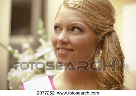 A bride-to-be in a formal hairdo looks up to the side; grand junction colorado united states of america View Large Photo Image Stock Image - A bride-to-be in a formal hairdo looks up to the side; grand junction colorado united states of america. Fotosearch