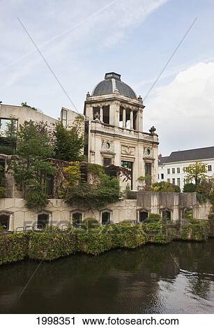 A Building Along The Water's Edge; Ghent Oost-Vlaanderen Belgium View Large Photo Image Stock Image - A Building Along The Water's Edge; Ghent Oost-Vlaanderen Belgium. Fotosearch