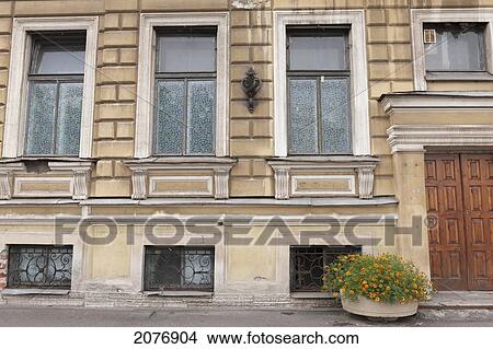 A building with a flower pot outside the entrance; st. petersburg russia View Large Photo Image Picture - A building with a flower pot outside the entrance; st. petersburg russia. Fotosearch