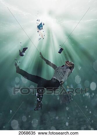 A Businesswoman Floating Underwater With Her Laptop Computer Cell Phone And Shoes; Cadiz Spain View Large Photo Image Stock Photography - A Businesswoman Floating Underwater With Her Laptop Computer Cell Phone And Shoes; Cadiz Spain. Fotosearch