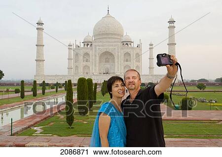 A couple takes a picture of themselves with the taj mahal in the background; agra uttar pradesh india View Large Photo Image Stock Image - A couple takes a picture of themselves with the taj mahal in the background; agra uttar pradesh india. Fotosearch