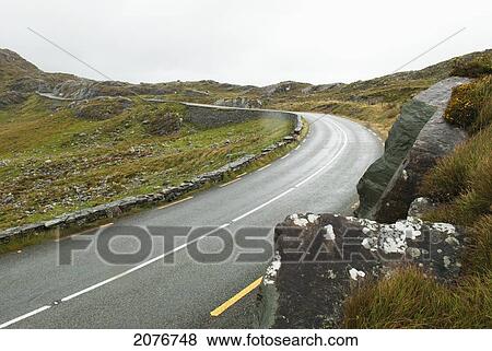 A curve in the road; gap of dunloe ireland View Large Photo Image Stock Photo - A curve in the road; gap of dunloe ireland. Fotosearch