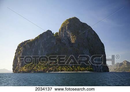 A Dramatic Island And White Sand Beach Near El Nido And Corong Corong; Bacuit Archipelago Palawan Philippines View Large Photo Image Stock Photo - A Dramatic Island And White Sand Beach Near El Nido And Corong Corong; Bacuit Archipelago Palawan Philippines. Fotosearch