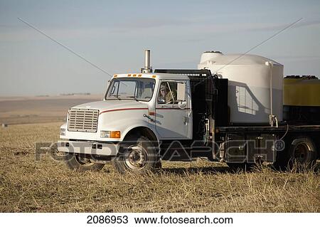 A farm truck for watering and fertilizing; three hills alberta canada View Large Photo Image Stock Image - A farm truck for watering and fertilizing; three hills alberta canada. Fotosearch