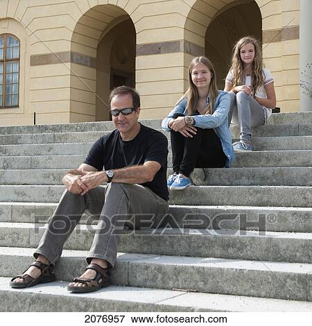 A father and two daughters sitting on steps at drottningholm palace; stockholm sweden View Large Photo Image Stock Photo - A father and two daughters sitting on steps at drottningholm palace; stockholm sweden. Fotosearch