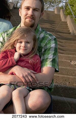 A father holding his young daughter; bellingham washington united states of america View Large Photo Image Stock Image - A father holding his young daughter; bellingham washington united states of america. Fotosearch