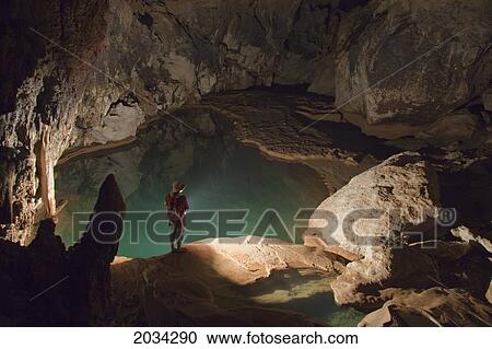 A Filipino Tour Guide Holds A Lantern Inside Sumaging Cave Or Big Cave Near Sagada; Luzon Philippines View Large Photo Image Stock Image - A Filipino Tour Guide Holds A Lantern Inside Sumaging Cave Or Big Cave Near Sagada; Luzon Philippines. Fotosearch