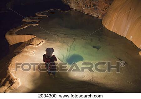 A Filipino Tour Guide Holds A Lantern Inside Sumaging Cave Or Big Cave Near Sagada; Luzon Philippines View Large Photo Image Stock Image - A Filipino Tour Guide Holds A Lantern Inside Sumaging Cave Or Big Cave Near Sagada; Luzon Philippines. Fotosearch