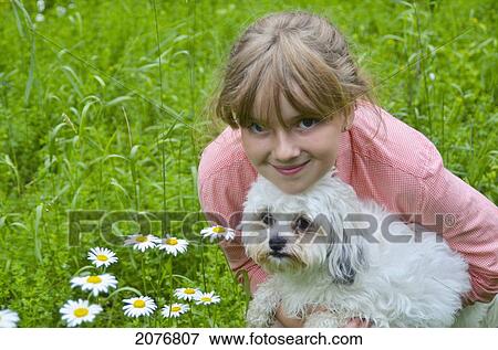A girl with a white dog; lake of the woods ontario canada View Large Photo Image Stock Photo - A girl with a white dog; lake of the woods ontario canada. Fotosearch