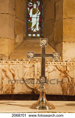 A Gold Decorative Cross In Front Of A Stained Glass Window; Old Bewick Northumberland England View Large Photo Image Stock Image - A Gold Decorative Cross In Front Of A Stained Glass Window; Old Bewick Northumberland England. Fotosearch