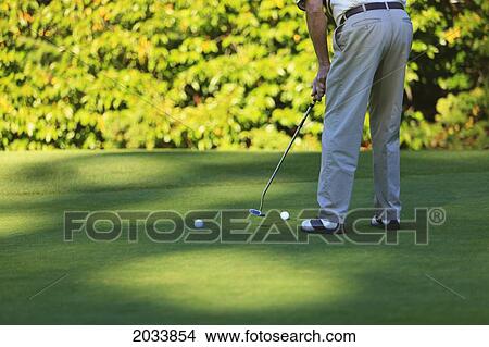 Picture - A Golfer At Lynnwood Golf Course; Lynnwood Washington United States Of America. Fotosearch