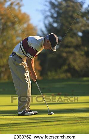 Stock Image - A Man Golfing At Lynnwood Golf Course; Lynnwood Washington United States Of America. Fotosearch