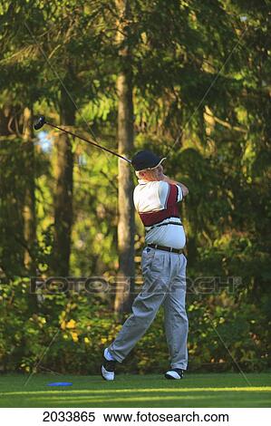 A Man Golfing At Lynnwood Golf Course; Lynnwood Washington United States Of America View Large Photo Image Stock Photography - A Man Golfing At Lynnwood Golf Course; Lynnwood Washington United States Of America. Fotosearch