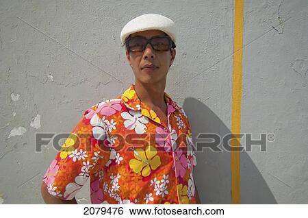 A man in a brightly coloured floral shirt against a wall; puerto rico View Large Photo Image Stock Photograph - A man in a brightly coloured floral shirt against a wall; puerto rico. Fotosearch
