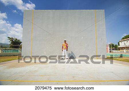 A man in a brightly coloured floral shirt against a wall; puerto rico View Large Photo Image Stock Photography - A man in a brightly coloured floral shirt against a wall; puerto rico. Fotosearch