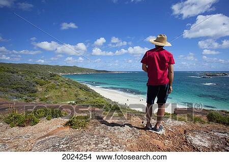 A Man Looks Out Over The White Sand Beach Cosy Corner Western Australia Australia View Large Photo Image Picture - A Man Looks Out Over The White Sand Beach Cosy Corner Western Australia Australia. Fotosearch