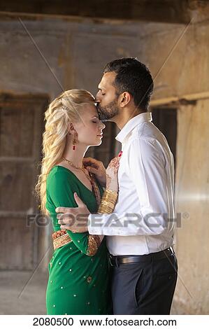 A mixed race couple in an embrace with her wearing a sari; ludhiana punjab india View Large Photo Image Stock Image - A mixed race couple in an embrace with her wearing a sari; ludhiana punjab india. Fotosearch