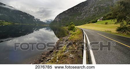 A paved road along granvinsvatnet lake; granvin hordaland norway View Large Photo Image Stock Photography - A paved road along granvinsvatnet lake; granvin hordaland norway. Fotosearch