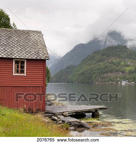 A red building and dock along hardangerfjord; hardangervidda norway View Large Photo Image Stock Photography - A red building and dock along hardangerfjord; hardangervidda norway. Fotosearch