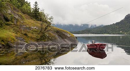 A red rowboat moored in bjorna fjord; hardangervidda norway View Large Photo Image Stock Image - A red rowboat moored in bjorna fjord; hardangervidda norway. Fotosearch