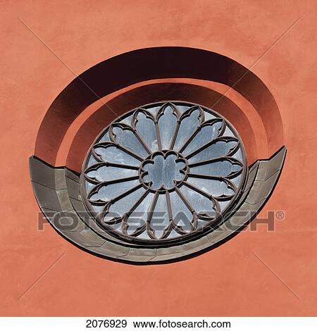 A round window with a flower design on a red painted wall; stockholm sweden View Large Photo Image Stock Photo - A round window with a flower design on a red painted wall; stockholm sweden. Fotosearch