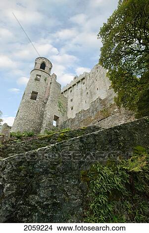 Picture - A Stone Wall And A Low Angle View Of Historic Buildings; Ireland. Fotosearch