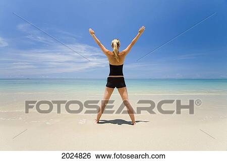 A Woman Does Yoga On A Tropical Island; Koh Lanta Krabi Province Thailand View Large Photo Image Stock Photograph - A Woman Does Yoga On A Tropical Island; Koh Lanta Krabi Province Thailand. Fotosearch