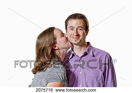 A Woman Kissing A Man On The Cheek View Large Photo Image Stock Photograph - A Woman Kissing A Man On The Cheek. Fotosearch