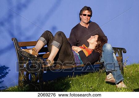 A Woman Rests Her Head In A Man's Lap On A Park Bench; Eyeries County Cork Ireland View Large Photo Image Stock Photograph - A Woman Rests Her Head In A Man's Lap On A Park Bench; Eyeries County Cork Ireland. Fotosearch