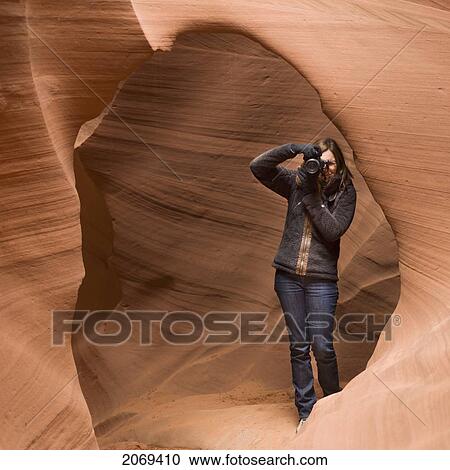 A Woman Takes A Photograph In Antelope Canyon; Arizona United States Of America View Large Photo Image Stock Image - A Woman Takes A Photograph In Antelope Canyon; Arizona United States Of America. Fotosearch