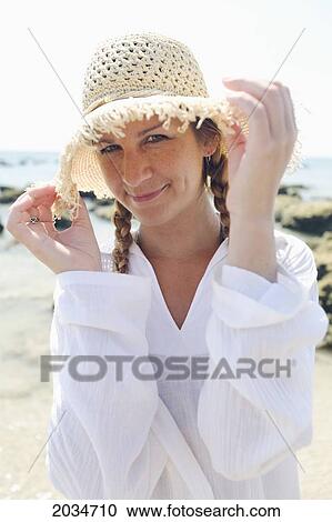 A Woman Tourist Enjoys The Sunshine On The Beach Of A Tropical Island; Koh Lanta Thailand View Large Photo Image Stock Image - A Woman Tourist Enjoys The Sunshine On The Beach Of A Tropical Island; Koh Lanta Thailand. Fotosearch