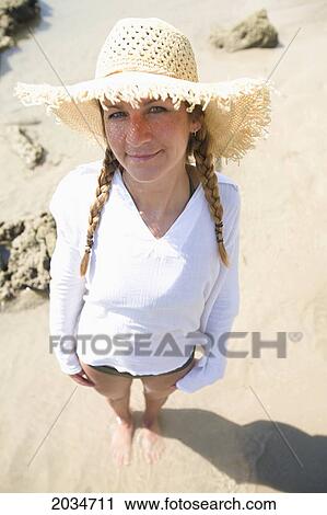 A Woman Tourist Enjoys The Sunshine On The Beach Of A Tropical Island; Koh Lanta Thailand View Large Photo Image Stock Image - A Woman Tourist Enjoys The Sunshine On The Beach Of A Tropical Island; Koh Lanta Thailand. Fotosearch
