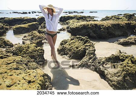 A Woman Tourist Enjoys The Sunshine On The Beach Of A Tropical Island; Koh Lanta Thailand View Large Photo Image Stock Photography - A Woman Tourist Enjoys The Sunshine On The Beach Of A Tropical Island; Koh Lanta Thailand. Fotosearch