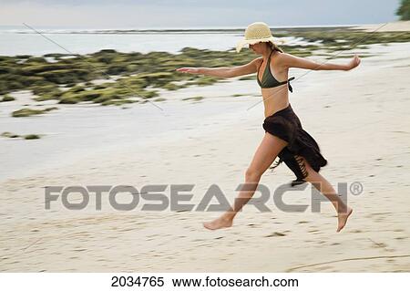 A Woman Tourist Walks On The Beach Of A Tropical Island; Koh Lanta Thailand View Large Photo Image Stock Photography - A Woman Tourist Walks On The Beach Of A Tropical Island; Koh Lanta Thailand. Fotosearch